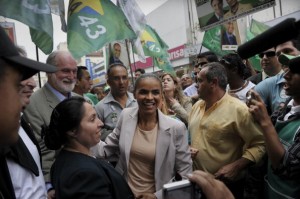 Brazilian presidential candidate for the Green Party Marina Silva is greeted by supporters as she campaigns in downtown Guarulhos