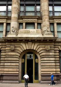 People walk past the Central Bank of Mexico in Mexico City
