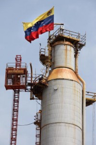 A Venezuelan flag is displayed on a oil refinery in the Venezuelan city of Moron