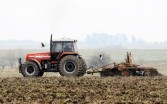 A farmer plows a field to sow wheat in Baradero, Buenos Aires