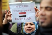 A woman holds a sign at a rally of Egyptian-American groups in New York
