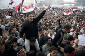 Egyptian anti-government demonstrators chant slogans as tens of thousands gather at Cairo's Tahrir Square