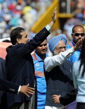 Manmohan Singh, India's prime minister, and Yusuf Raza Gilani, his Pakistani counterpart, wave to spectators before the start of the ICC world cup semi-final