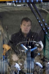 Russian President Dmitry Medvedev sits inside a tractor during a sugar beet harvest in Maloarkhangelsk on October 2, 2009. 