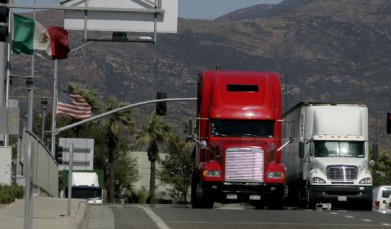Trucks cross the US-Mexico border