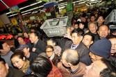 Chinese shoppers crowd a shop in an effort to buy salt in Lanzhou, northwest China's Gansu province