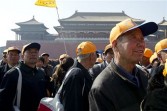 eople tour the Forbidden City in Beijing, China, on Tuesday, March 29, 2011