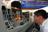 A man looks at a model of Japan's Mitshubishi group nuclear reactor at an exhibition on nuclear power being held in Hanoi on May 28, 2010. 