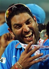 Indian cricketer Yuvraj Singh reacts after receiving man of the match medal during the prize distribution ceremony after the final One Day International (ODI) match between India and New Zealand 