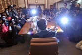 Bank of Korea governor Kim Choong-Soo (C) presides over the Monetary Policy Committee meeting at the central bank in Seoul 