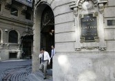 People leave the Santiago Stock Exchange in Santiago Chile, on Tuesday, June 2, 2009.
