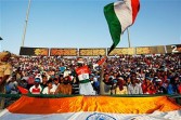 Spectators enjoy the atmosphere during the 2011 ICC World Cup second Semi-Final between India and Pakistan at Punjab Cricket Association (PCA) Stadium on March 30, 2011.