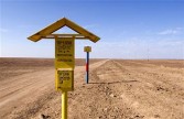 Markers for an underground oil pipeline than run from here, its source in Atasu, Kazakhstan, to Alashankau, China, October 9, 2006.