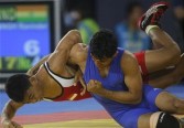 wrestling Ravinder Singh (R) of India fights Muhammed Aliansyah of Indonesia during the men�s Greco-Roman 60 kg wrestling competiton at the 16th Asian Games in Guangzhou on November 21, 2010.
