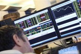 A trader in front of his screen at Global Equities, a French company