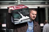 Hungarian shopper walks home with a new vacuum cleaner