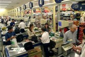 Cashiers ring up sales at a Pao de Acucar supermarket in Sao Paulo, Brazil, on Tuesday, April 20, 2004.