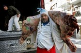 Argentinian worker unloads meat