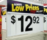 Wal-Mart 'Always Low Prices' signage is seen in an outside back storage area of a Wal-Mart store December 7, 2004 in Wheeling, Illinois.