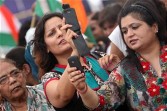 Supporters of Anna Hazare take mobile phone pictures