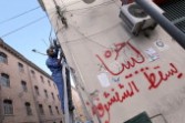 A Libyan electrician fixes a telephone line in Tripoli Oct 2011