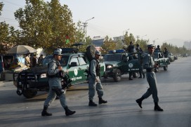 Afghan security personnel patrol near the American University in Kabul after the August attack