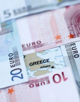 Euro banknotes placed on a map of Greece. Photo: Dado Ruvic, Reuters