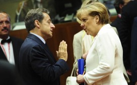 Sarkozy and Merkel talk during an EU summit in June 2011. Photo: AP