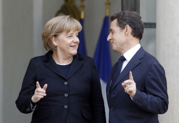 Nicolas Sarkozy and Angela Merkel prior to their meeting at the Elysee Palace on Monday. Photo: Remy de la Mauvinere/AP
